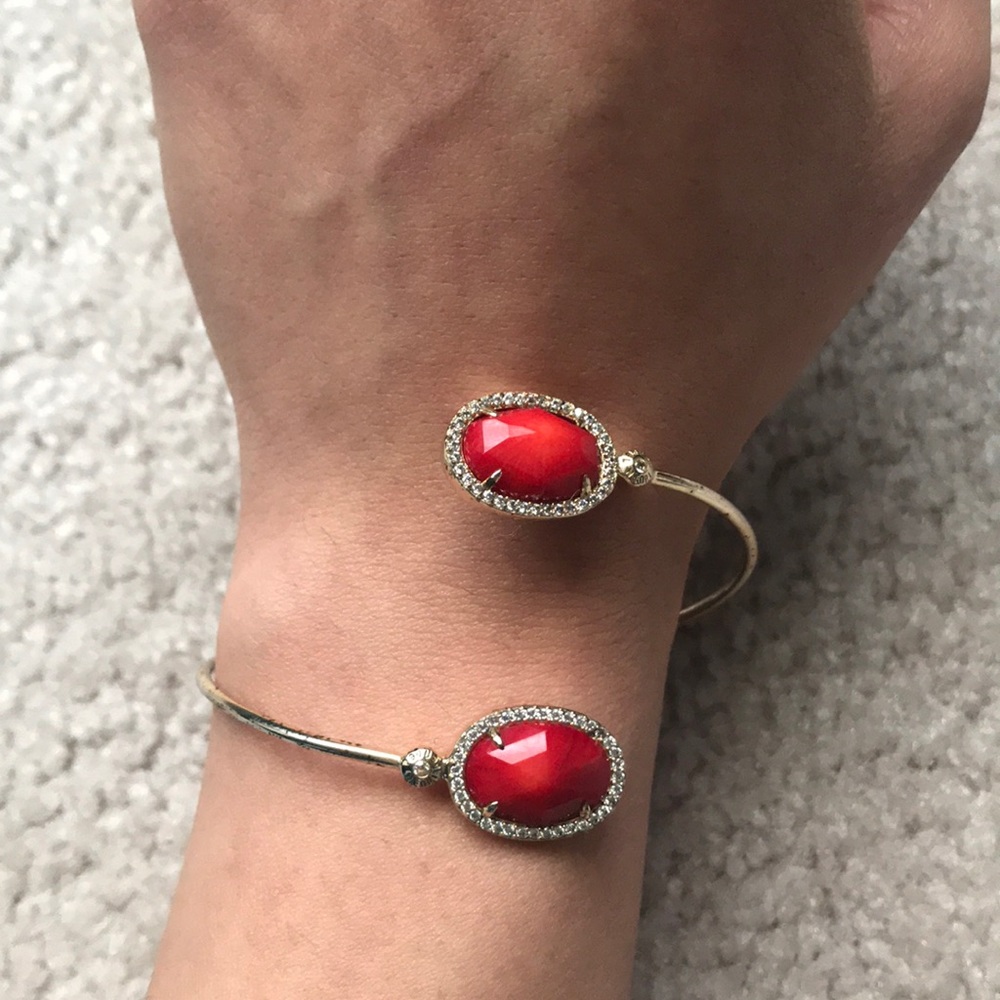 Henri Bendel gold and ruby red twist bracelet
